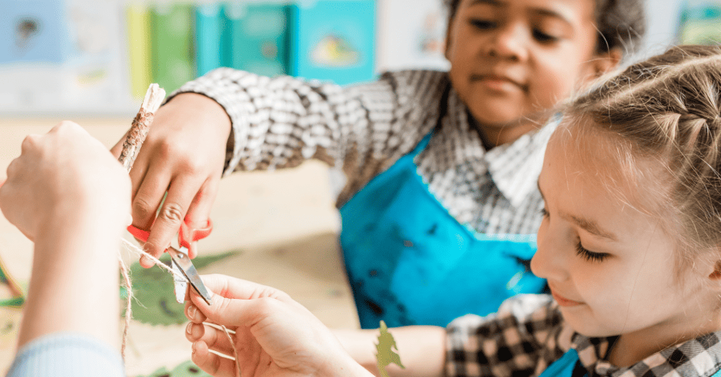 two children creating a christian easter craft
