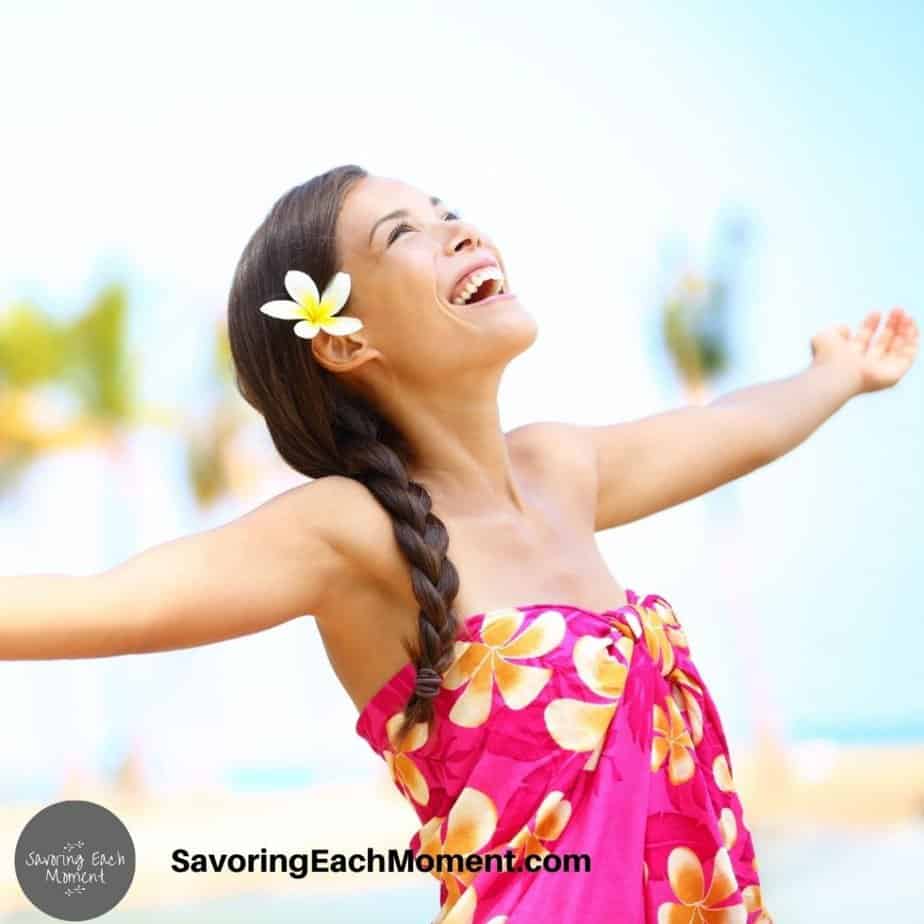 Lady in pink dress experiencing joy from Christian self-care