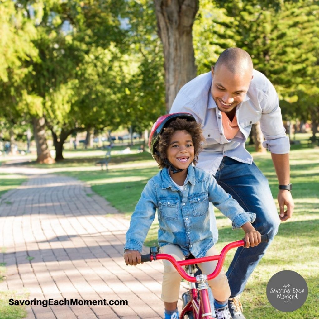 dad with girl on bike - using words of encouragement