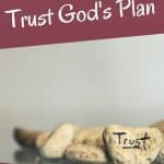 small rocks with the word trust - how to trust God's plan