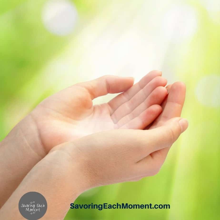 open hands of woman letting go and letting God lead in her life