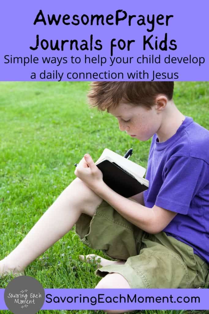 boy sitting in the grass writing in his prayer journal for kids