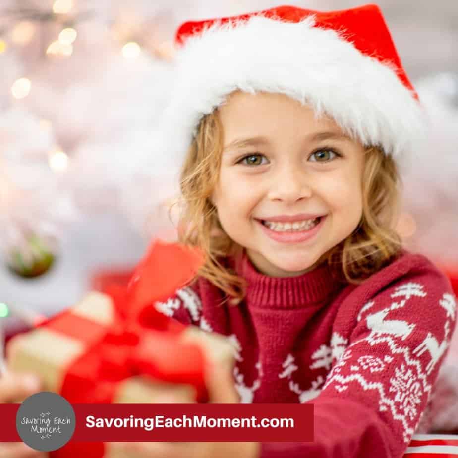 random acts of kindness for kids with a little girl giving a gift