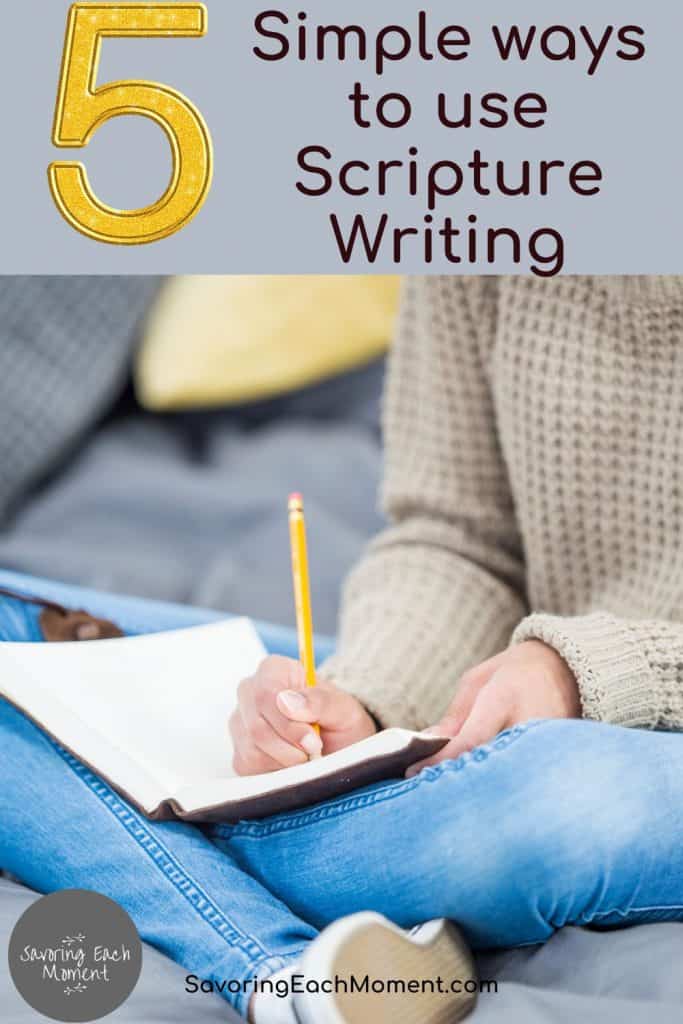 woman writing scriptures in her journal