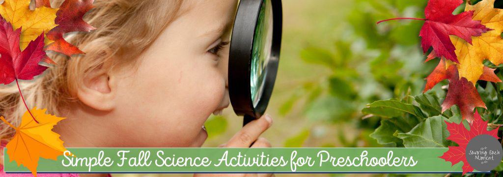 Preschooler looking through magnifying enjoying a fall science activity