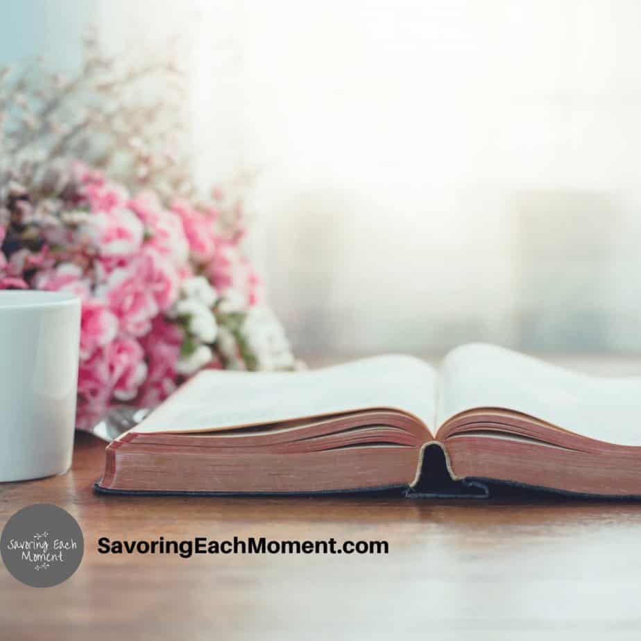 gratitude scriptures in an open bible on a desk with flowers
